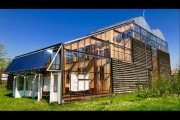 Greenhouse-wrapped Rotterdam home regulates climate & grows food