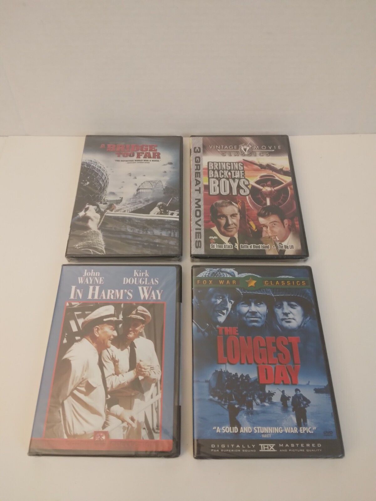 4 DVDS:The Longest Day/In Harm's Way/Bringing Back The Boys/A Bridge Too Far